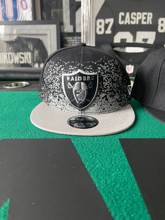 RAIDERS GREY SPLASH HAT - SNAP BACK ONE SIZE FITS ALL